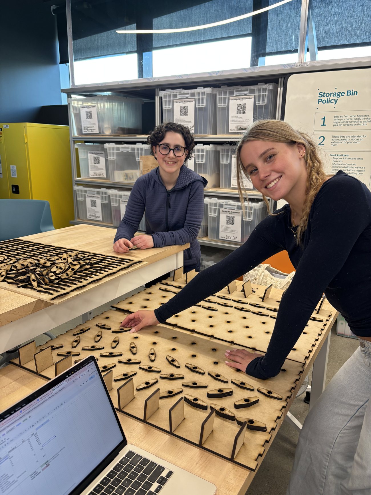 Siena and a teammate with the Turn the Gears board during the build